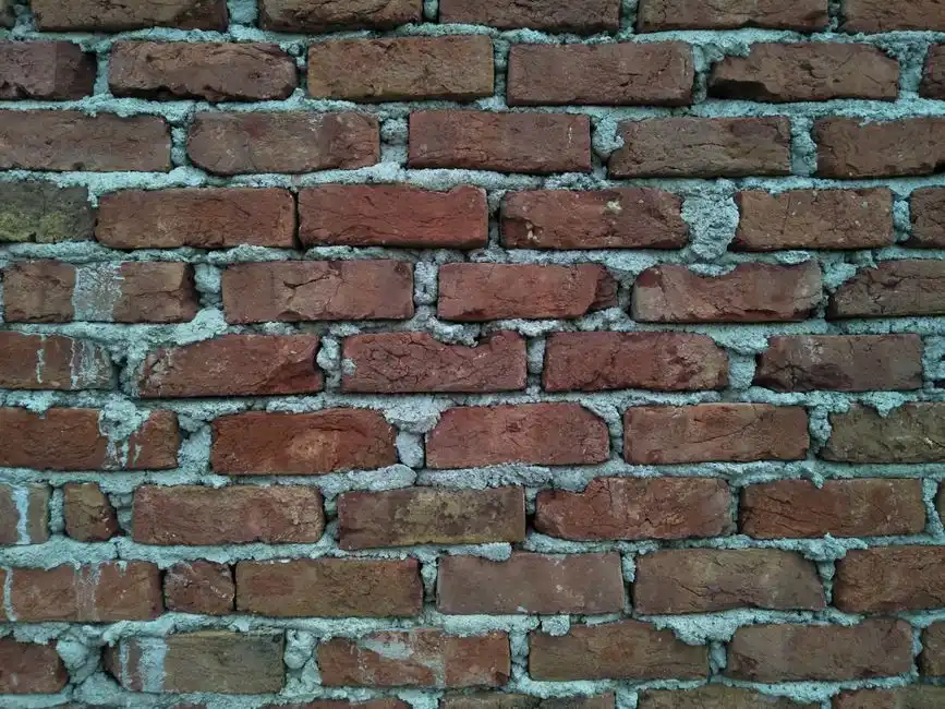 Close-up view of a classic red brick wall showcasing rich texture and craftsmanship.